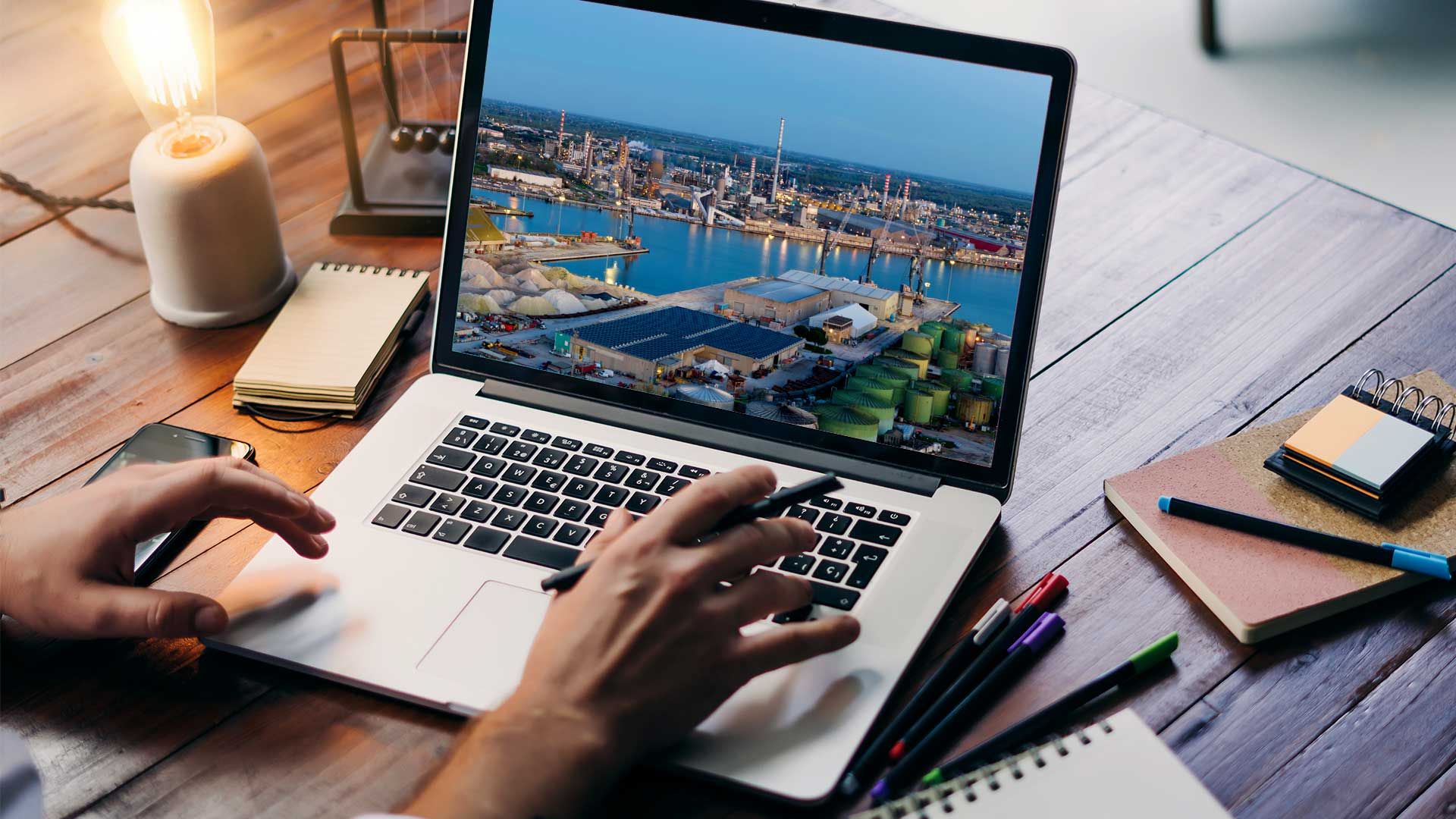 Businessman searching a logistic hub in Italy on his laptop